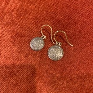 Dainty diamond earrings.